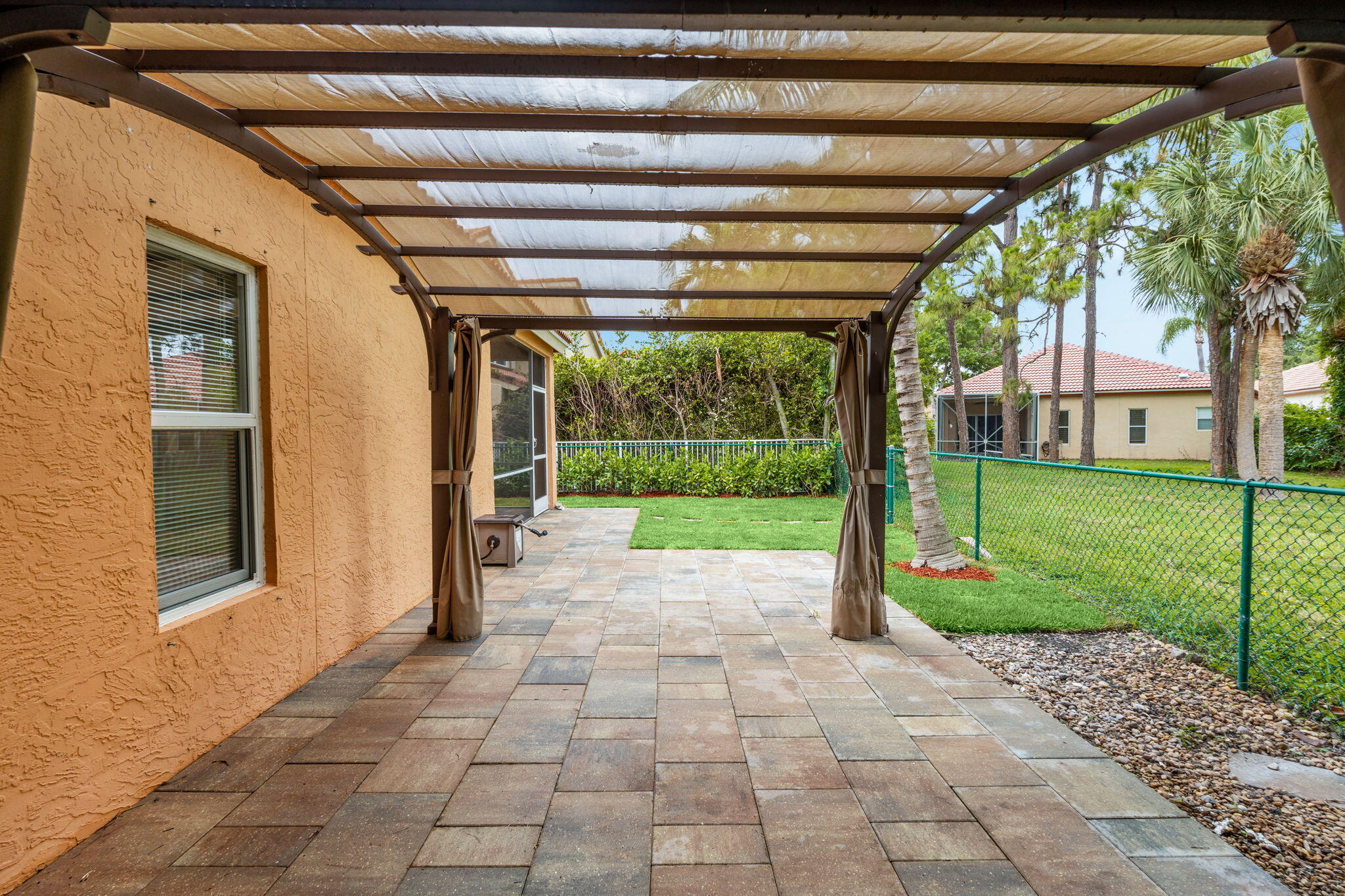 5122 Elpine Way Riviera Beach, FL 33418 - Photo 13 of 35 a view of a porch with a backyard