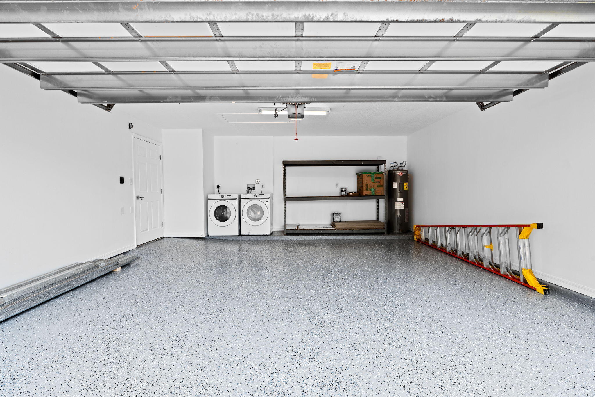 5122 Elpine Way Riviera Beach, FL 33418 - Photo 17 of 35 a view of a garage