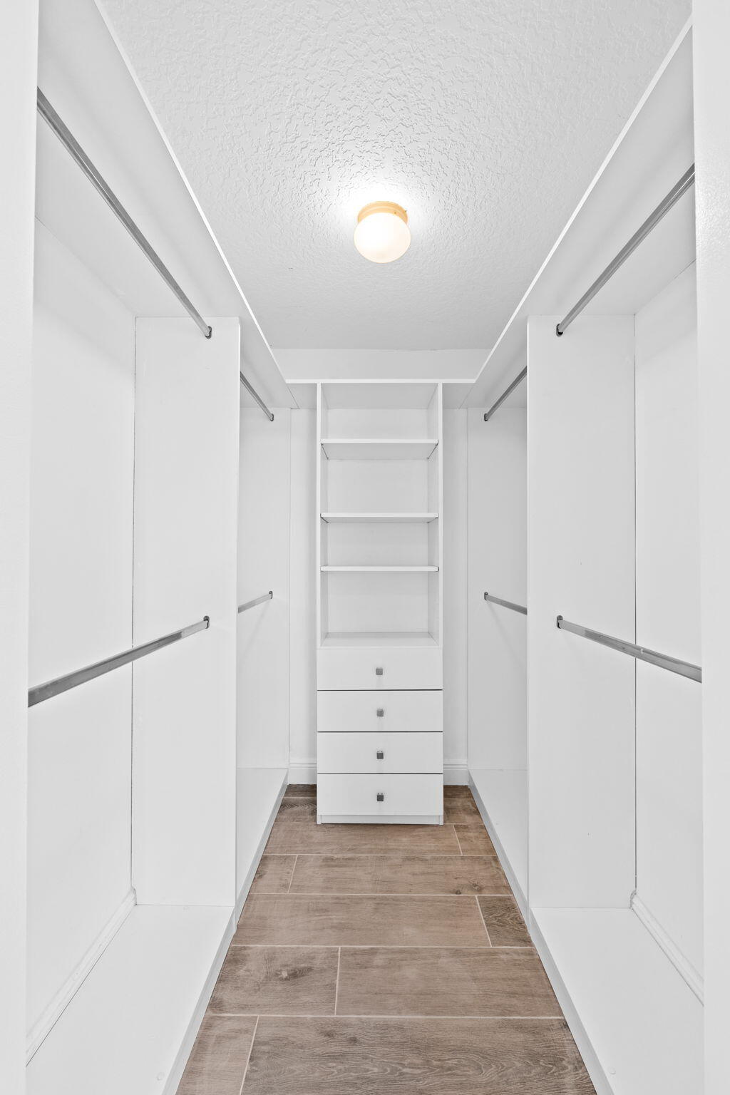 5122 Elpine Way Riviera Beach, FL 33418 - Photo 22 of 35 a view of an empty walk in closet