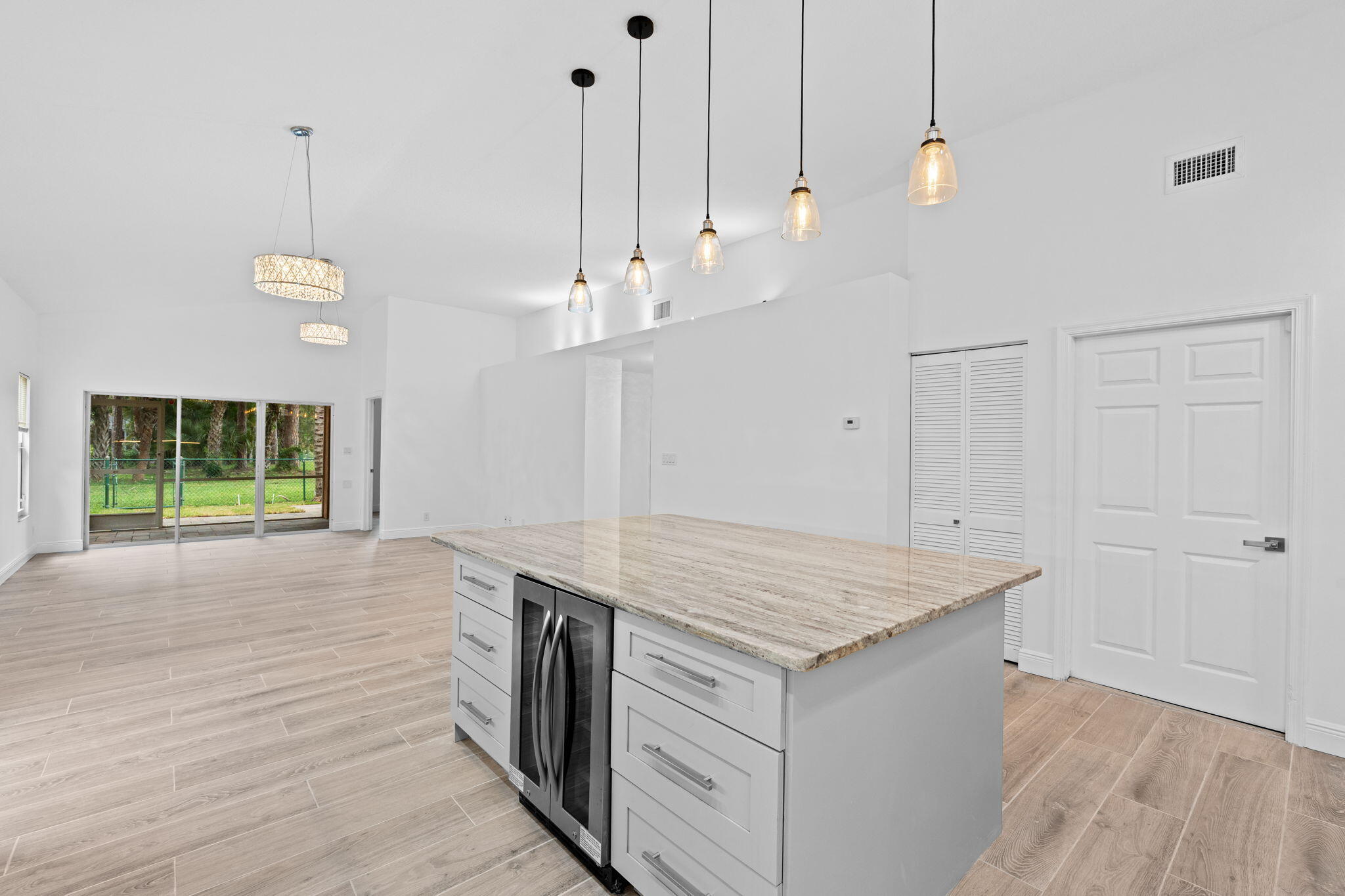 5122 Elpine Way Riviera Beach, FL 33418 - Photo 28 of 35 a kitchen that has a lot of cabinets in it
