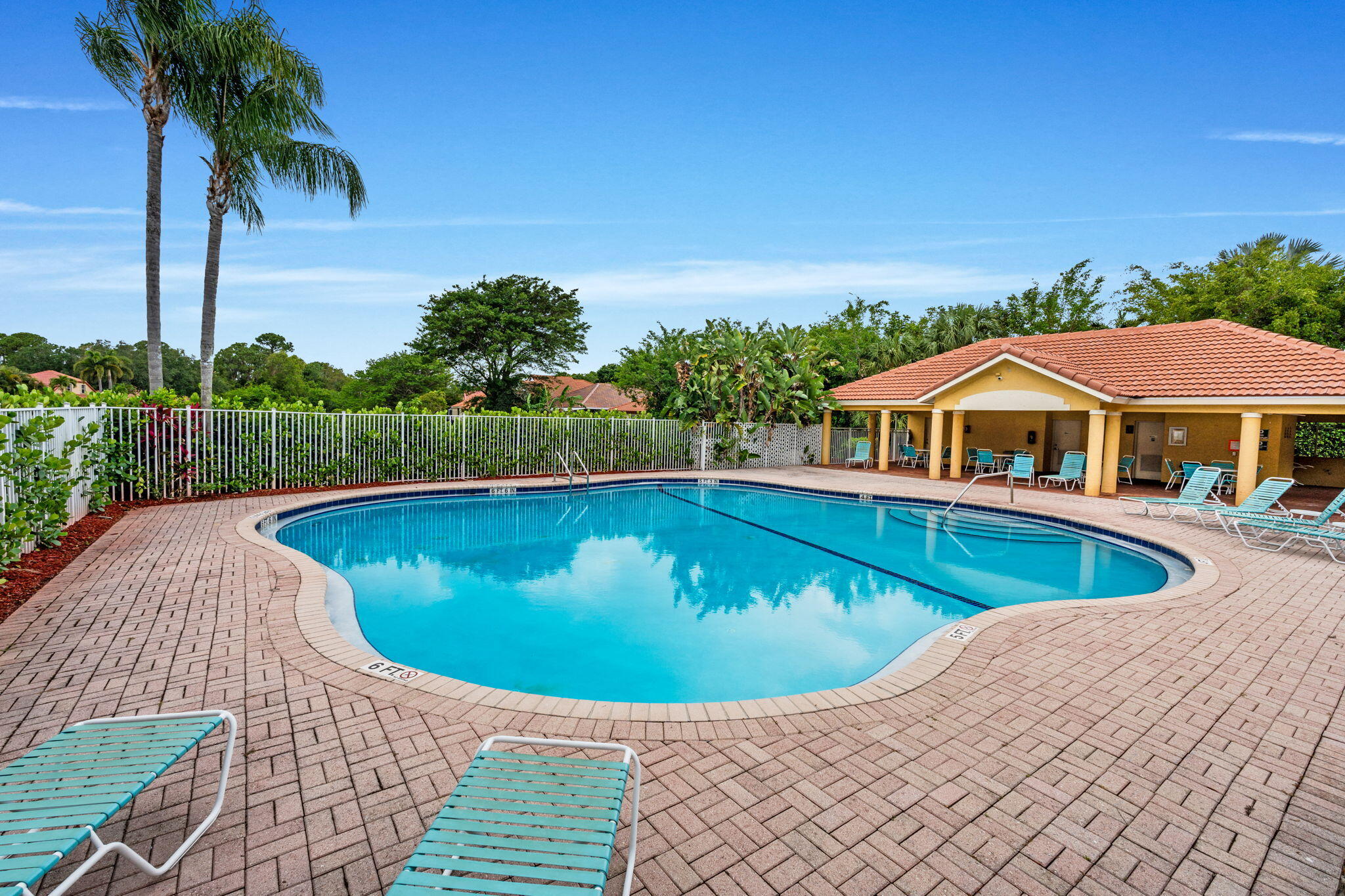 5122 Elpine Way Riviera Beach, FL 33418 - Photo 29 of 35 a view of swimming pool with lawn chairs under an umbrella