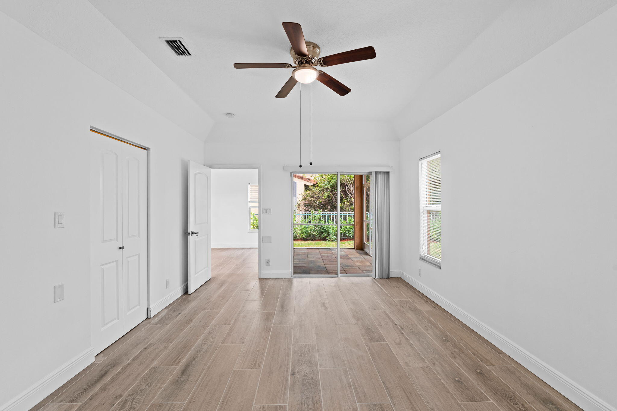 5122 Elpine Way Riviera Beach, FL 33418 - Photo 3 of 35 a view of room with window ceiling fan and hardwood floor