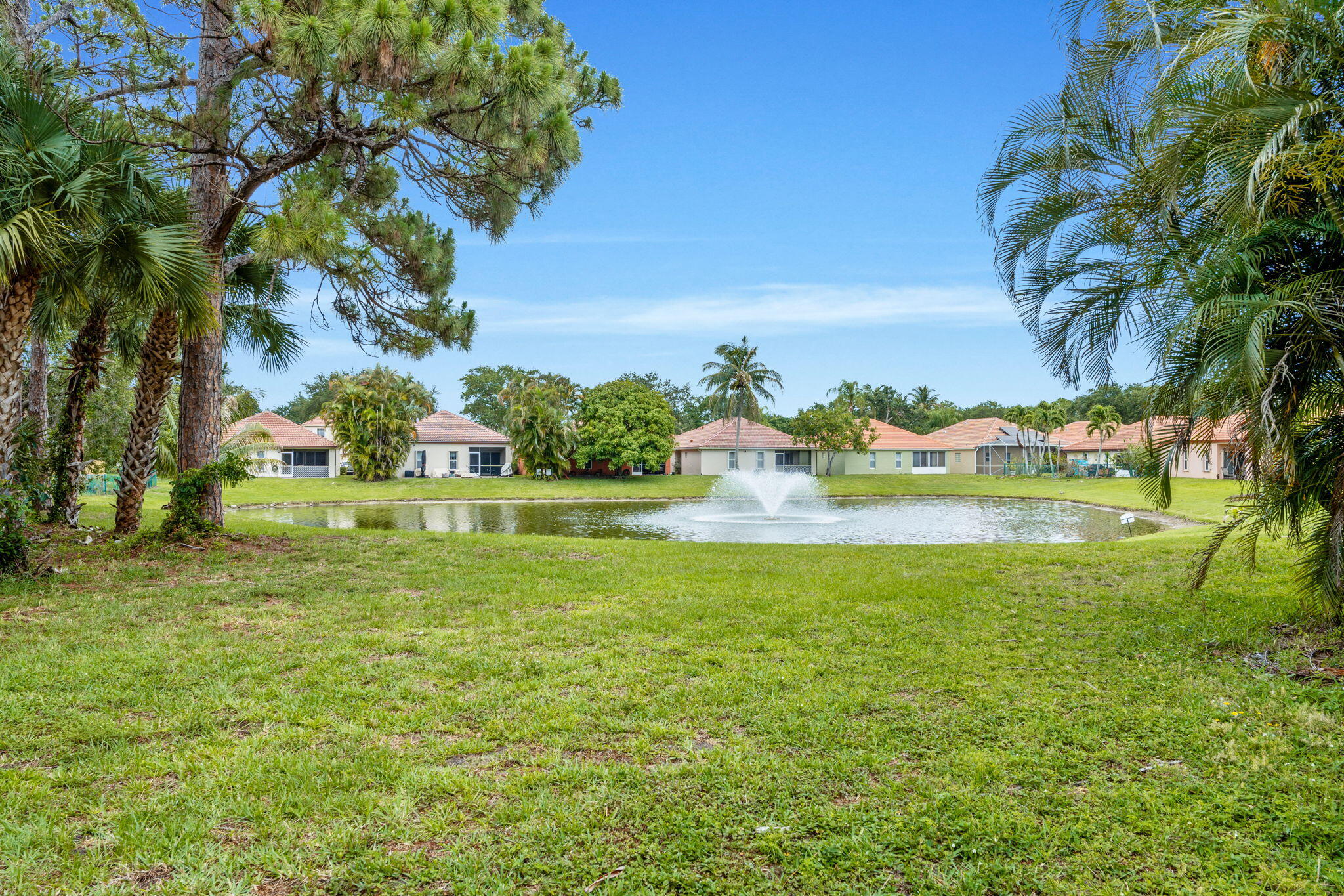 5122 Elpine Way Riviera Beach, FL 33418 - Photo 31 of 35 a view of a garden with a lake