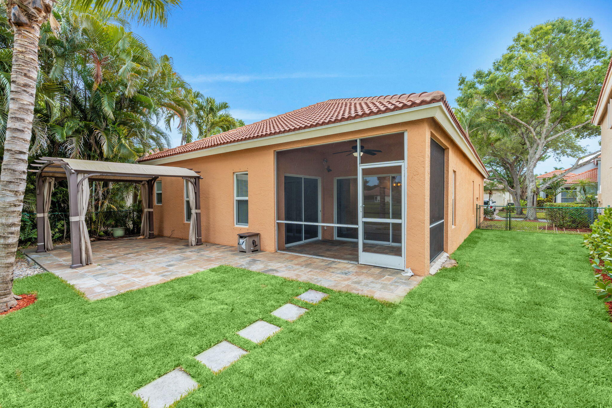 5122 Elpine Way Riviera Beach, FL 33418 - Photo 9 of 35 a view of a house with a yard and sitting area