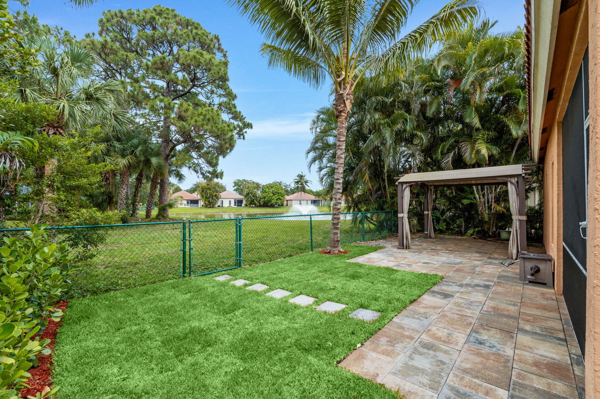 5122 Elpine Way Riviera Beach, FL 33418 - Photo 10 of 35 a view of a backyard with a garden