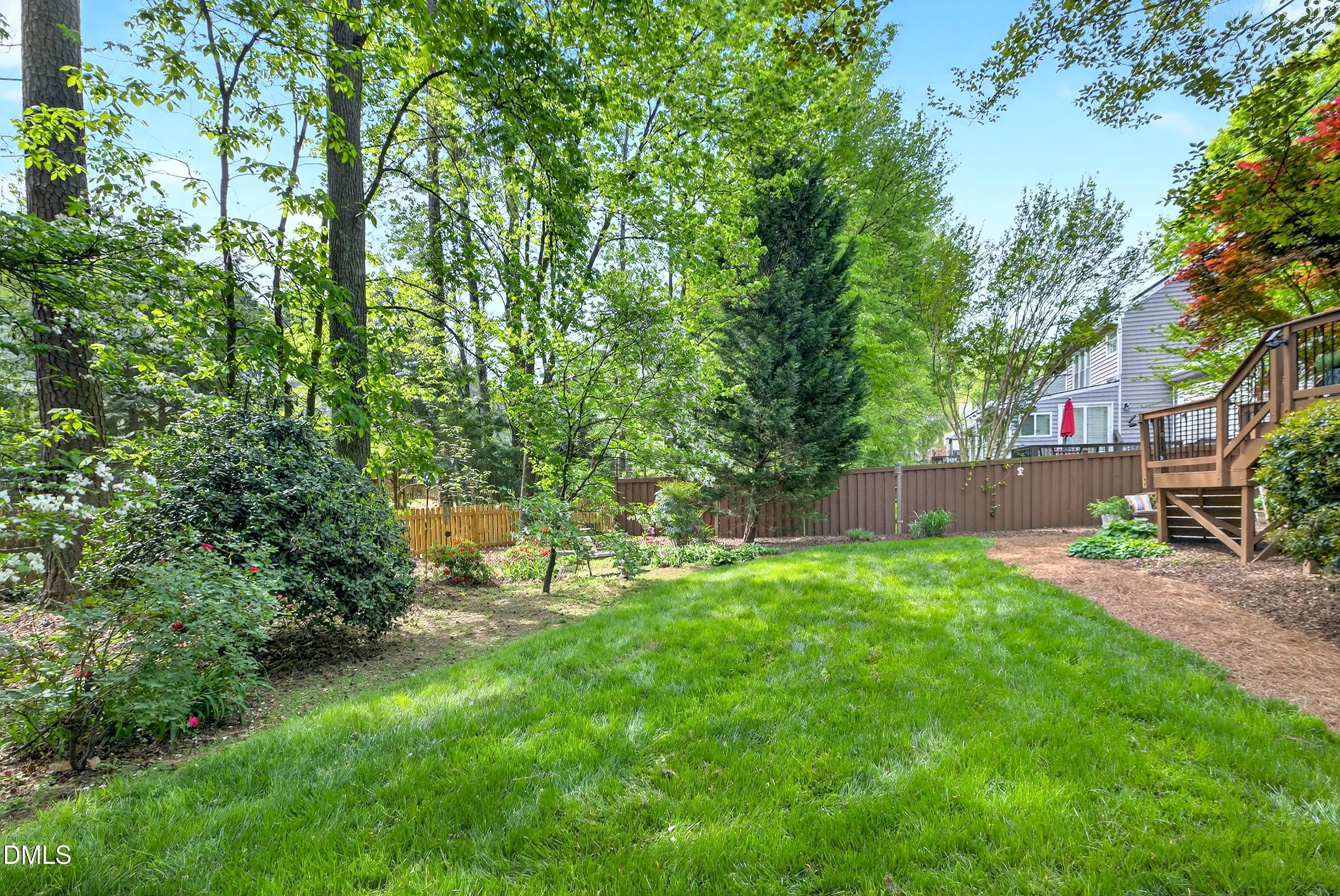 9432 Cartersville Court Raleigh, NC 27617 - Photo 55 of 66 a backyard of a house with seating space