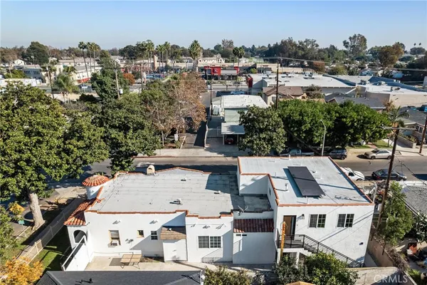 an aerial view of residential houses with outdoor space