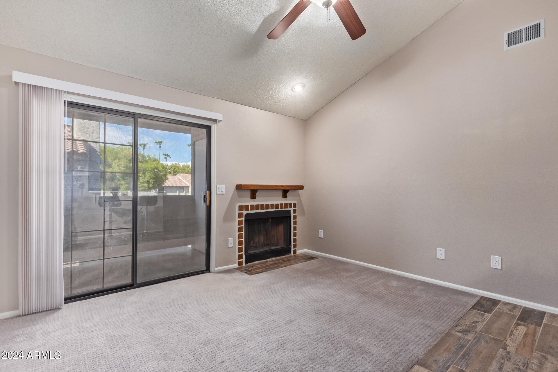 533 West Guadalupe Road, Unit 2046 Mesa, AZ 85210 - Photo 4 of 29 an empty room with fireplace