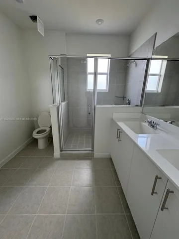 a view of kitchen with microwave and cabinets
