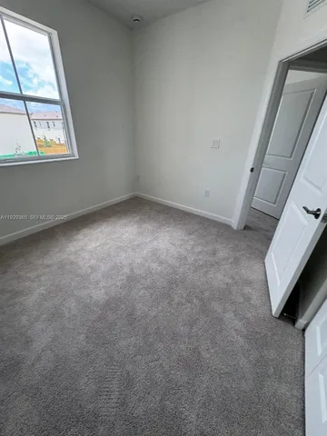 a kitchen with a cabinets and window