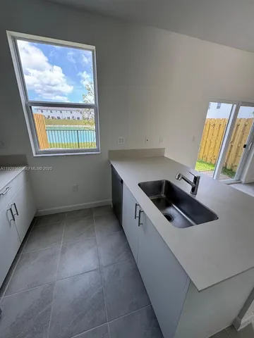 a view of a hallway with windows