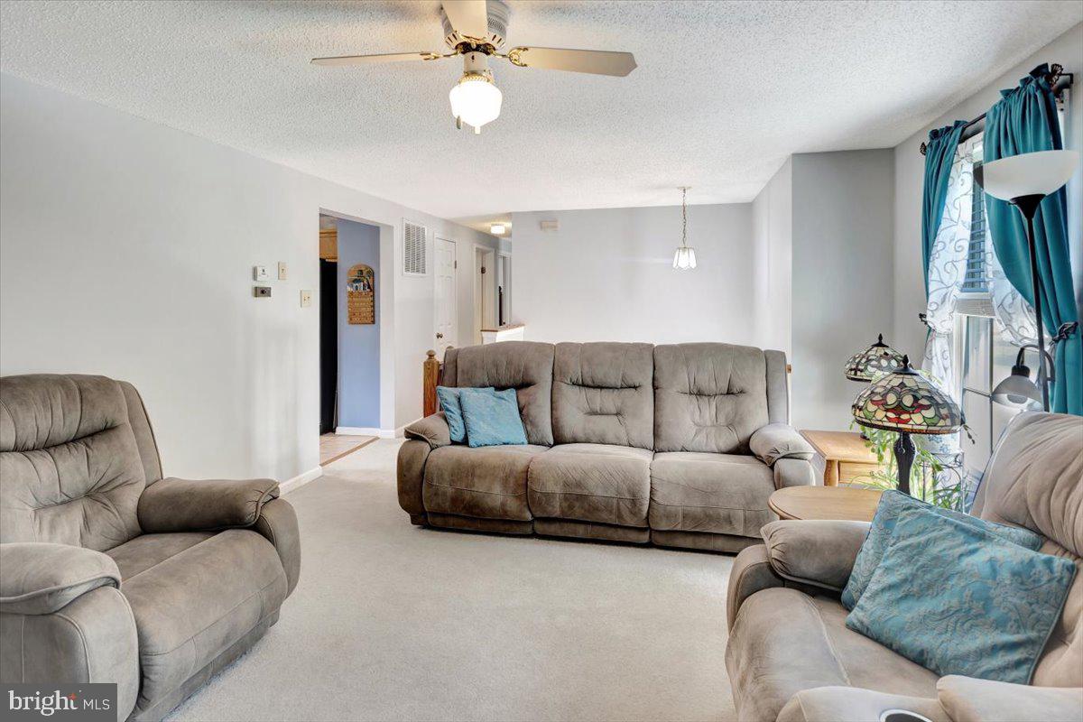 13226 Susquehanna Road Baltimore, MD 21220 - Photo 16 of 43 a living room with furniture and a large window