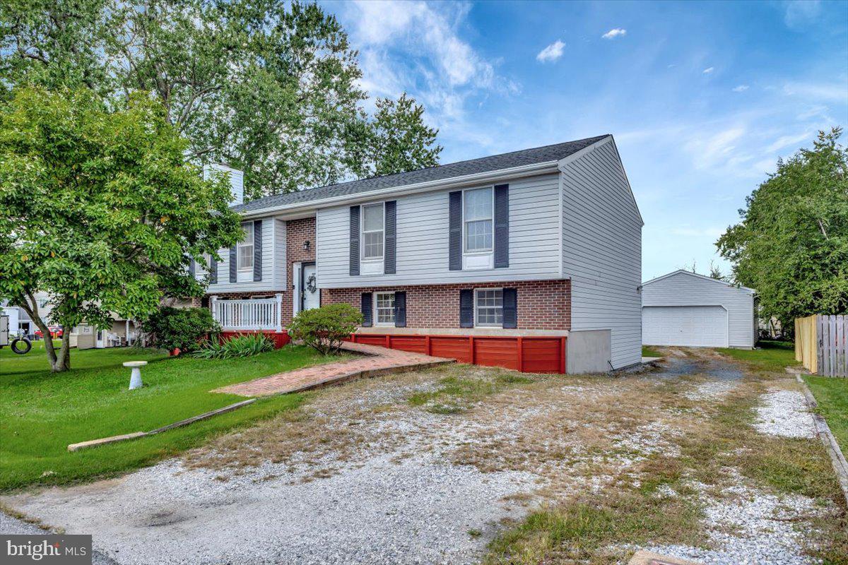 13226 Susquehanna Road Baltimore, MD 21220 - Photo 2 of 43 a front view of house with yard and trees