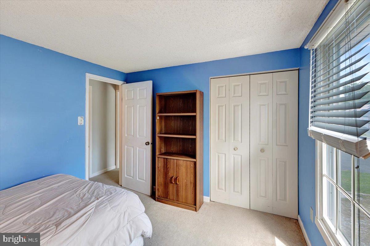 13226 Susquehanna Road Baltimore, MD 21220 - Photo 26 of 43 a bedroom with a bed and a window