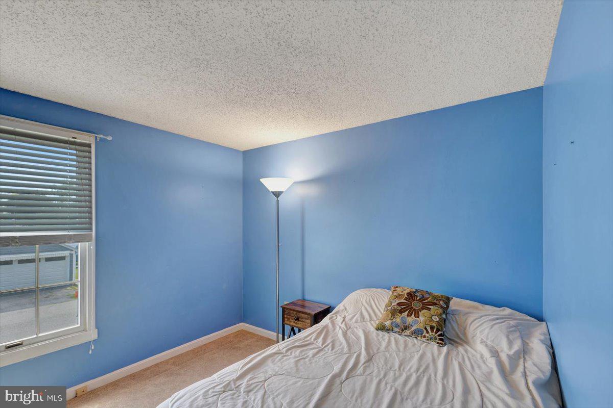 13226 Susquehanna Road Baltimore, MD 21220 - Photo 27 of 43 a bedroom with a bed and a window