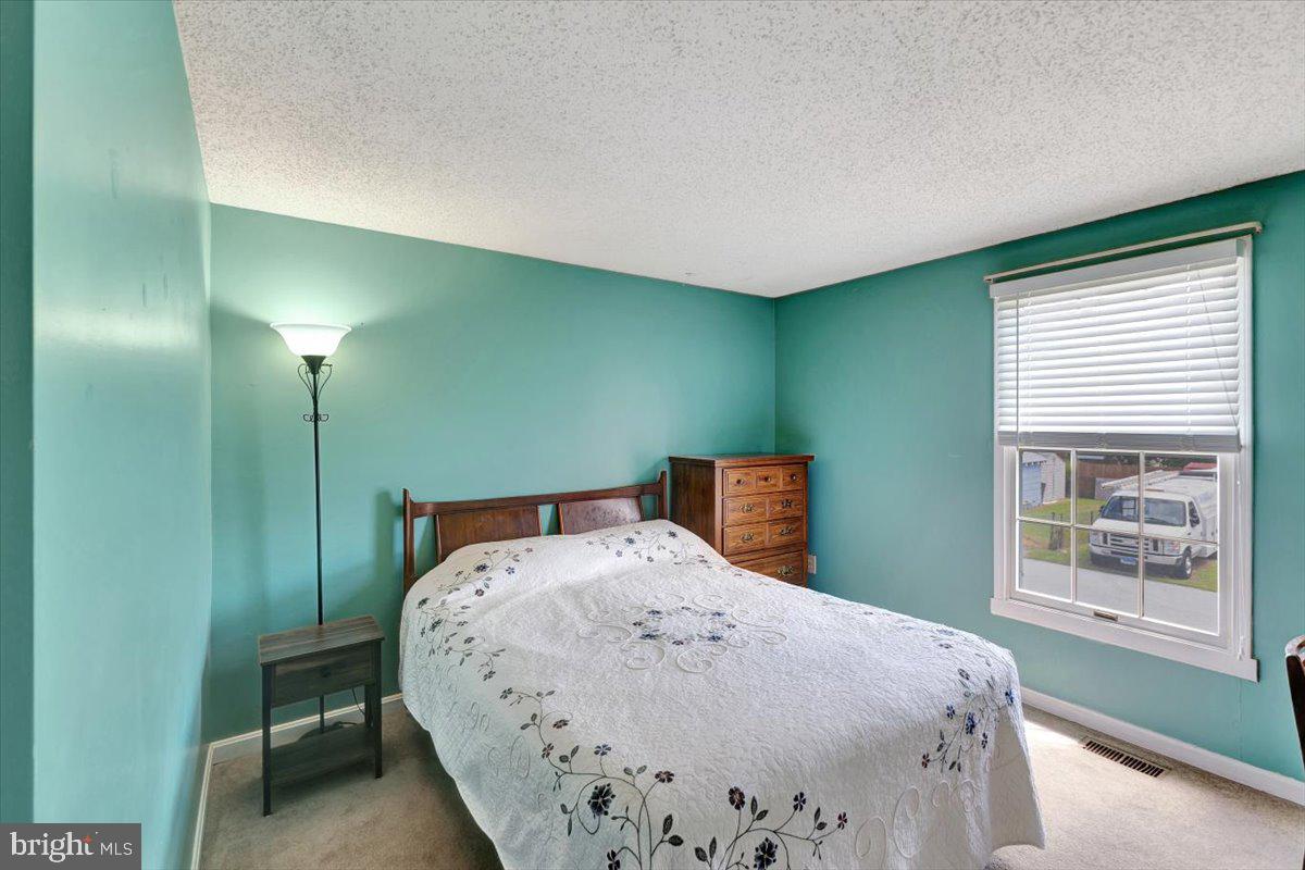 13226 Susquehanna Road Baltimore, MD 21220 - Photo 29 of 43 a bedroom with a bed and window