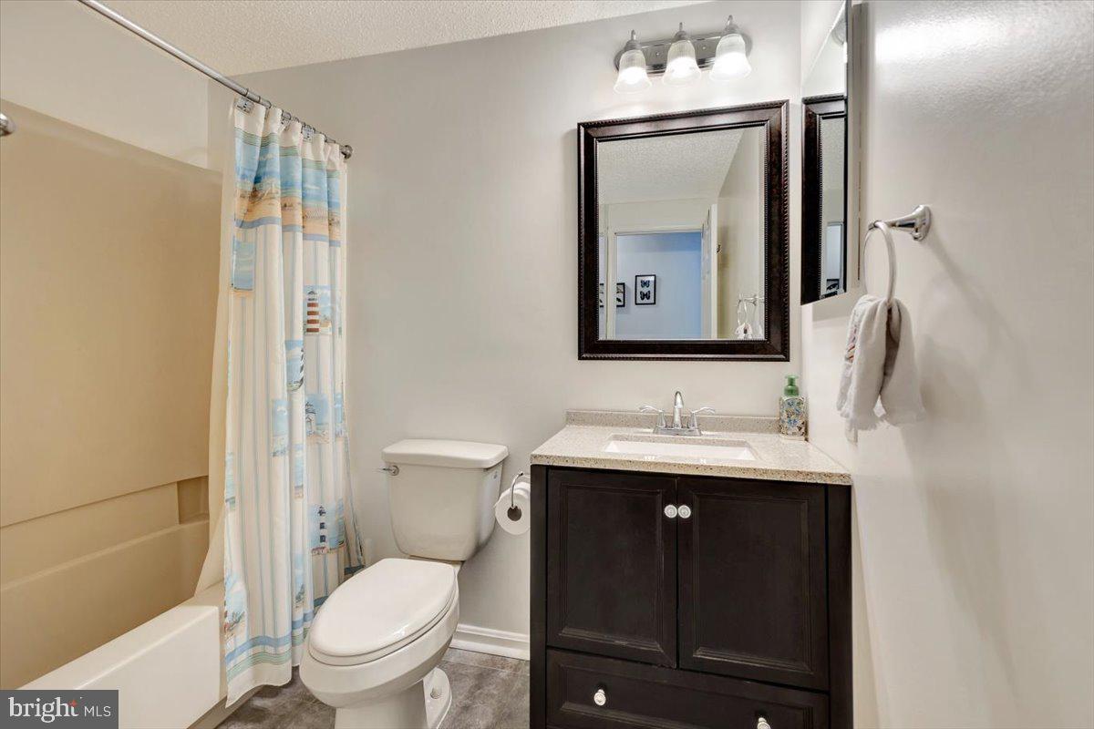 13226 Susquehanna Road Baltimore, MD 21220 - Photo 30 of 43 a bathroom with a toilet sink and mirror