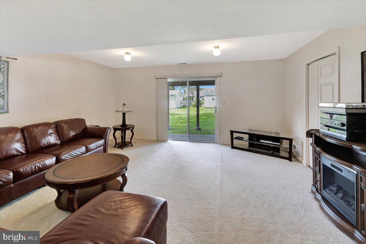 13226 Susquehanna Road Baltimore, MD 21220 - Photo 32 of 43 a living room with furniture and a fireplace
