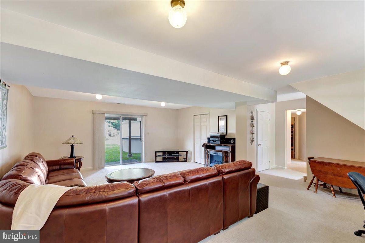 13226 Susquehanna Road Baltimore, MD 21220 - Photo 33 of 43 a living room with furniture and a chandelier