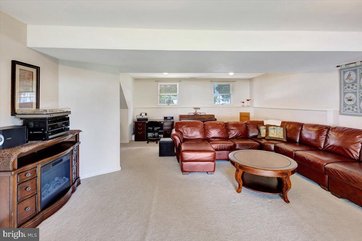 13226 Susquehanna Road Baltimore, MD 21220 - Photo 34 of 43 a living room with furniture a rug and a window