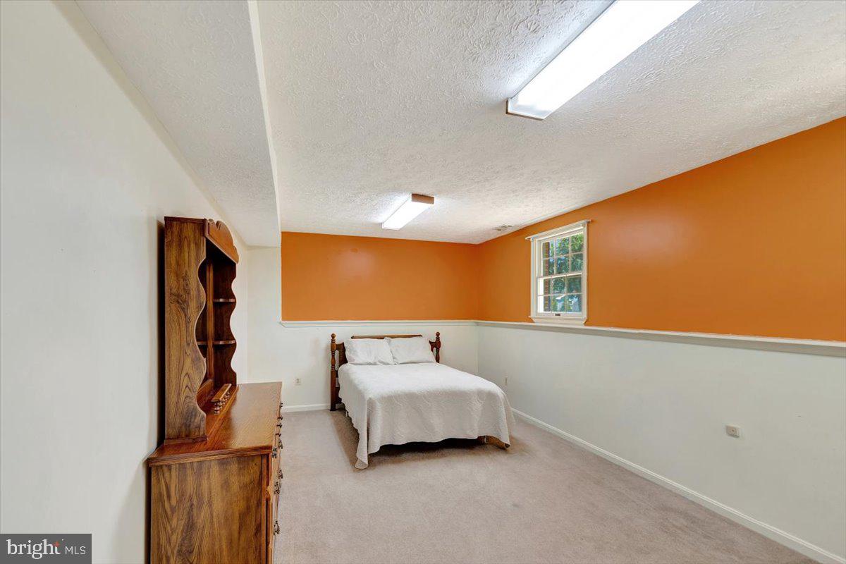 13226 Susquehanna Road Baltimore, MD 21220 - Photo 35 of 43 a bedroom with furniture and window