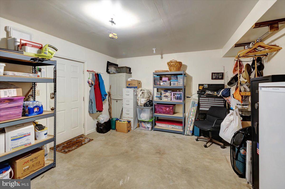 13226 Susquehanna Road Baltimore, MD 21220 - Photo 37 of 43 a view of walk in closet with clothes and shoes