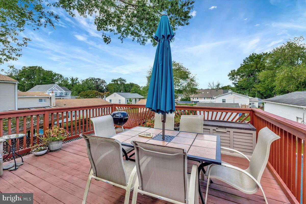 13226 Susquehanna Road Baltimore, MD 21220 - Photo 7 of 43 a view of a balcony with wooden floor and outdoor seating