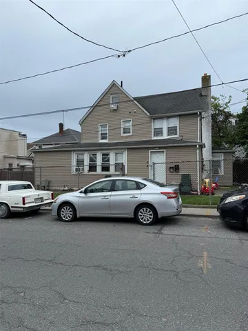 a car parked in front of a house