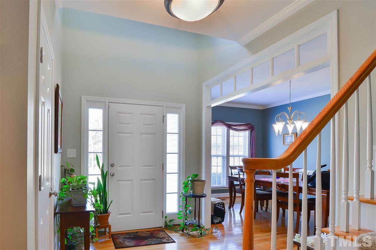 4415 Pike Road Raleigh, NC 27613 - Photo 2 of 19 a view of an entryway with wooden floor and windows