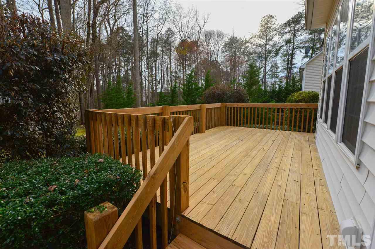 4415 Pike Road Raleigh, NC 27613 - Photo 17 of 19 a view of balcony with wooden floor and trees