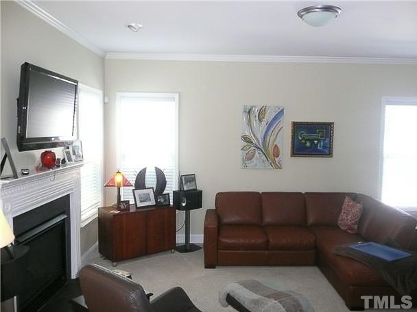 4415 Pike Road Raleigh, NC 27613 - Photo 6 of 19 a living room with furniture fireplace and a window