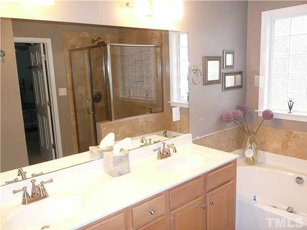 4415 Pike Road Raleigh, NC 27613 - Photo 9 of 19 a bathroom with a sink and a mirror