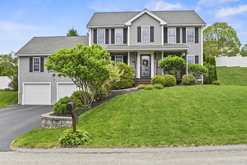 18 Jackson Avenue Rutland, MA 01543 - Photo 1 of 24 a front view of a house with a garden
