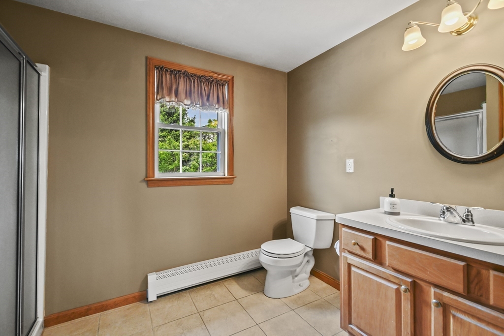 18 Jackson Avenue Rutland, MA 01543 - Photo 11 of 24 a bathroom with a sink a toilet and a window
