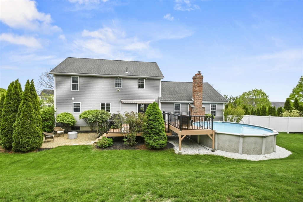 18 Jackson Avenue Rutland, MA 01543 - Photo 17 of 24 a front view of a house with a garden and plants