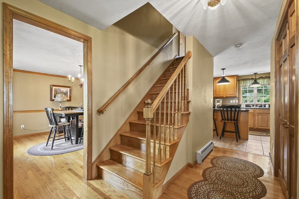 18 Jackson Avenue Rutland, MA 01543 - Photo 5 of 24 a view of entryway and hall with wooden floor