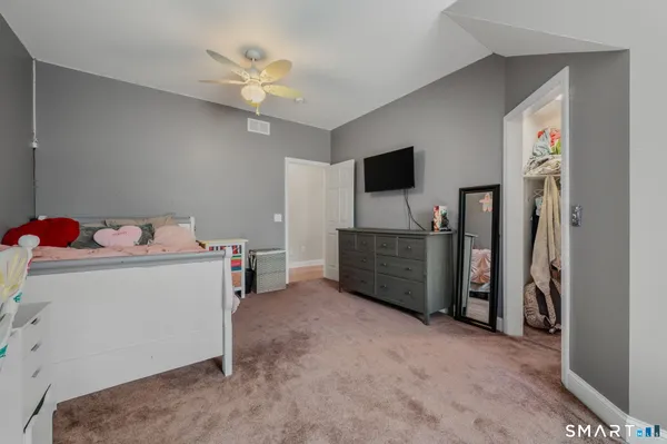a view of a room with a flat screen tv