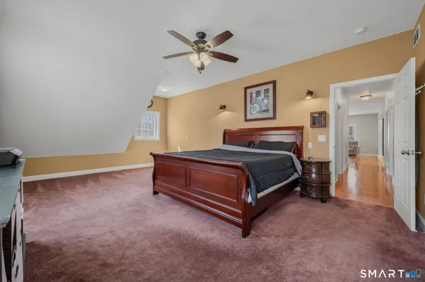 a bedroom with a bed and window