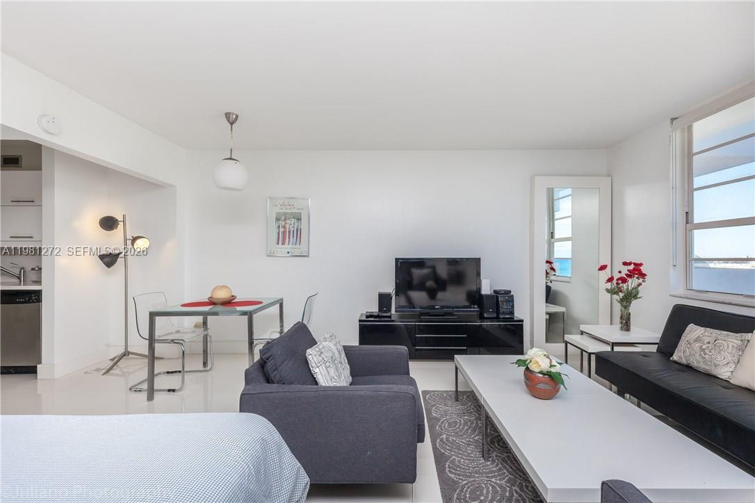 100 Lincoln Road, Unit 806 Miami Beach, FL 33139 - Photo 14 of 23 a living room with furniture and a flat screen tv