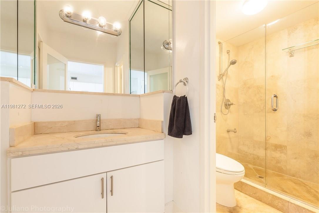 100 Lincoln Road, Unit 806 Miami Beach, FL 33139 - Photo 19 of 23 a bathroom with a sink and a mirror