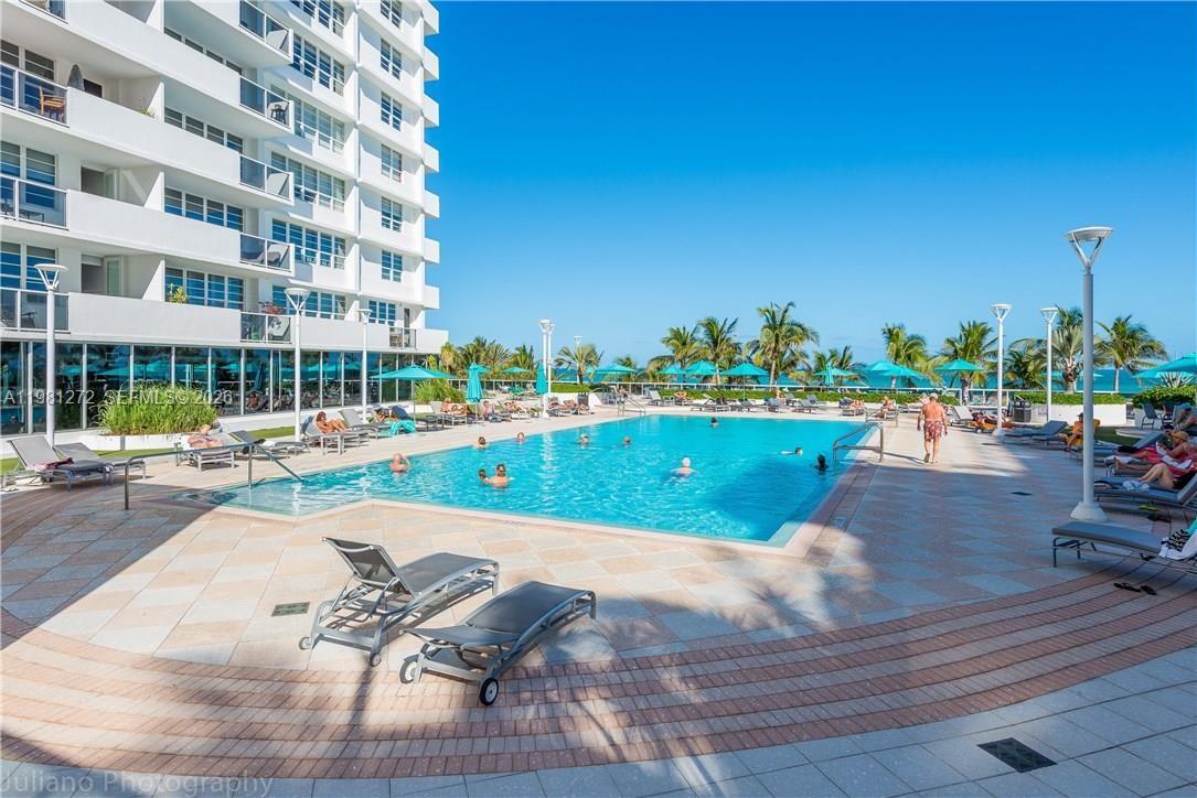 100 Lincoln Road, Unit 806 Miami Beach, FL 33139 - Photo 23 of 23 a view of a swimming pool with a patio
