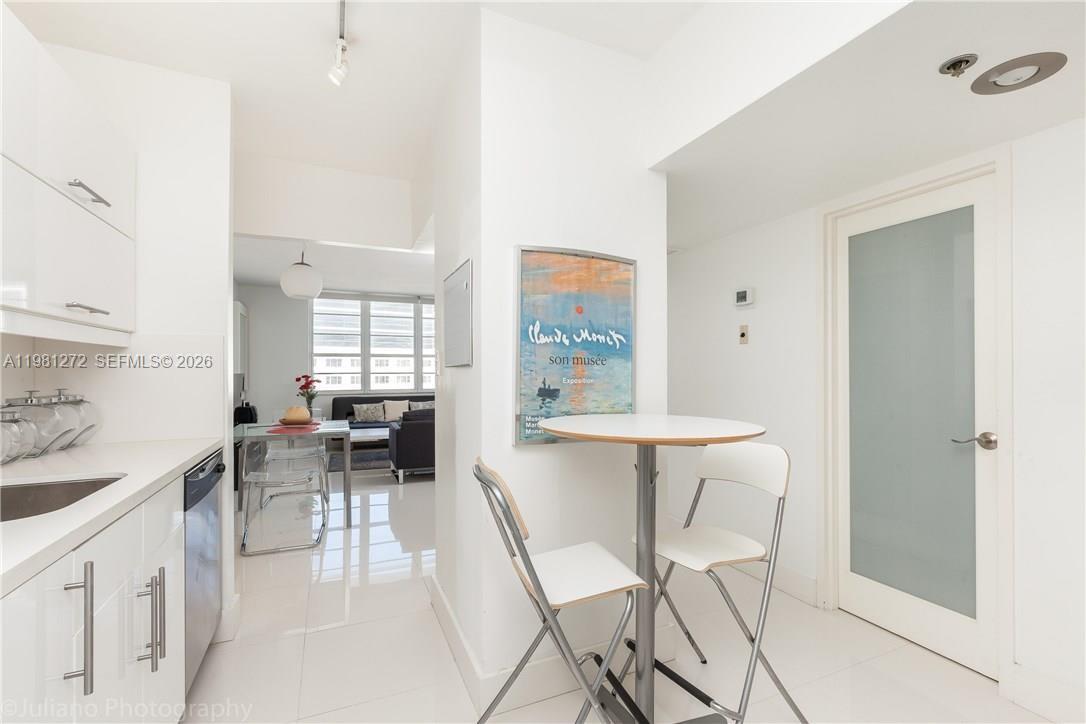 100 Lincoln Road, Unit 806 Miami Beach, FL 33139 - Photo 6 of 23 a view of a dining room with furniture and a window