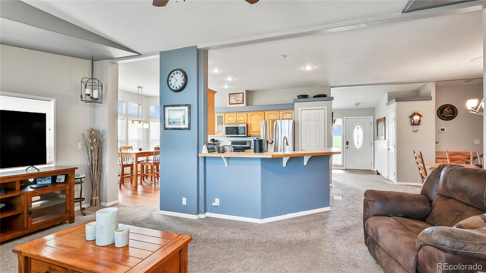 48984 County Road Akron, CO 80720 - Photo 14 of 35 a living room with furniture and a flat screen tv
