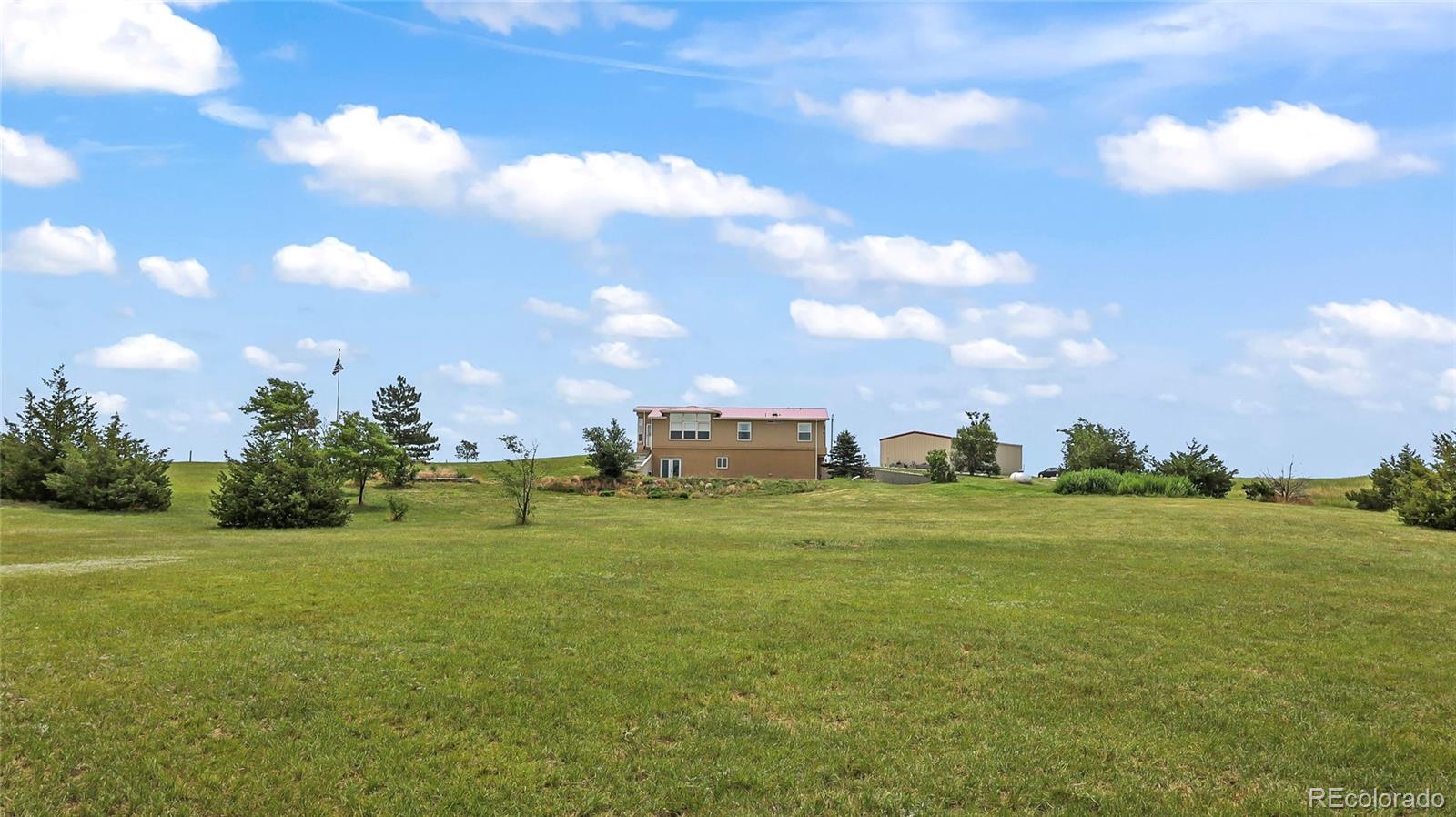 48984 County Road Akron, CO 80720 - Photo 2 of 35 a view of a big building with big yard