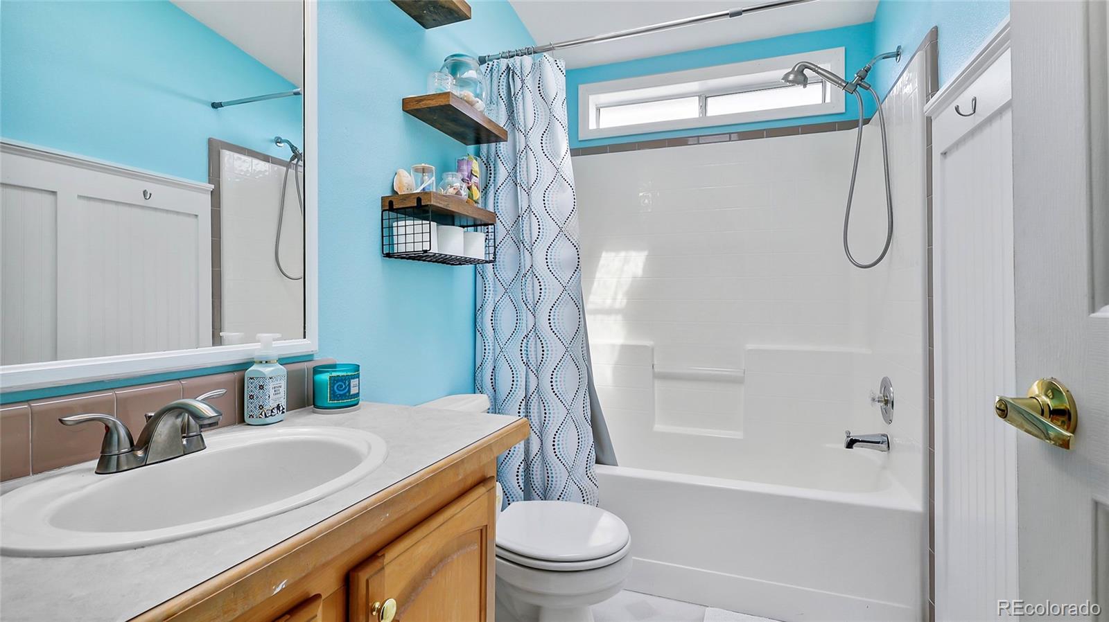 48984 County Road Akron, CO 80720 - Photo 22 of 35 a bathroom with a sink a toilet and a bathtub