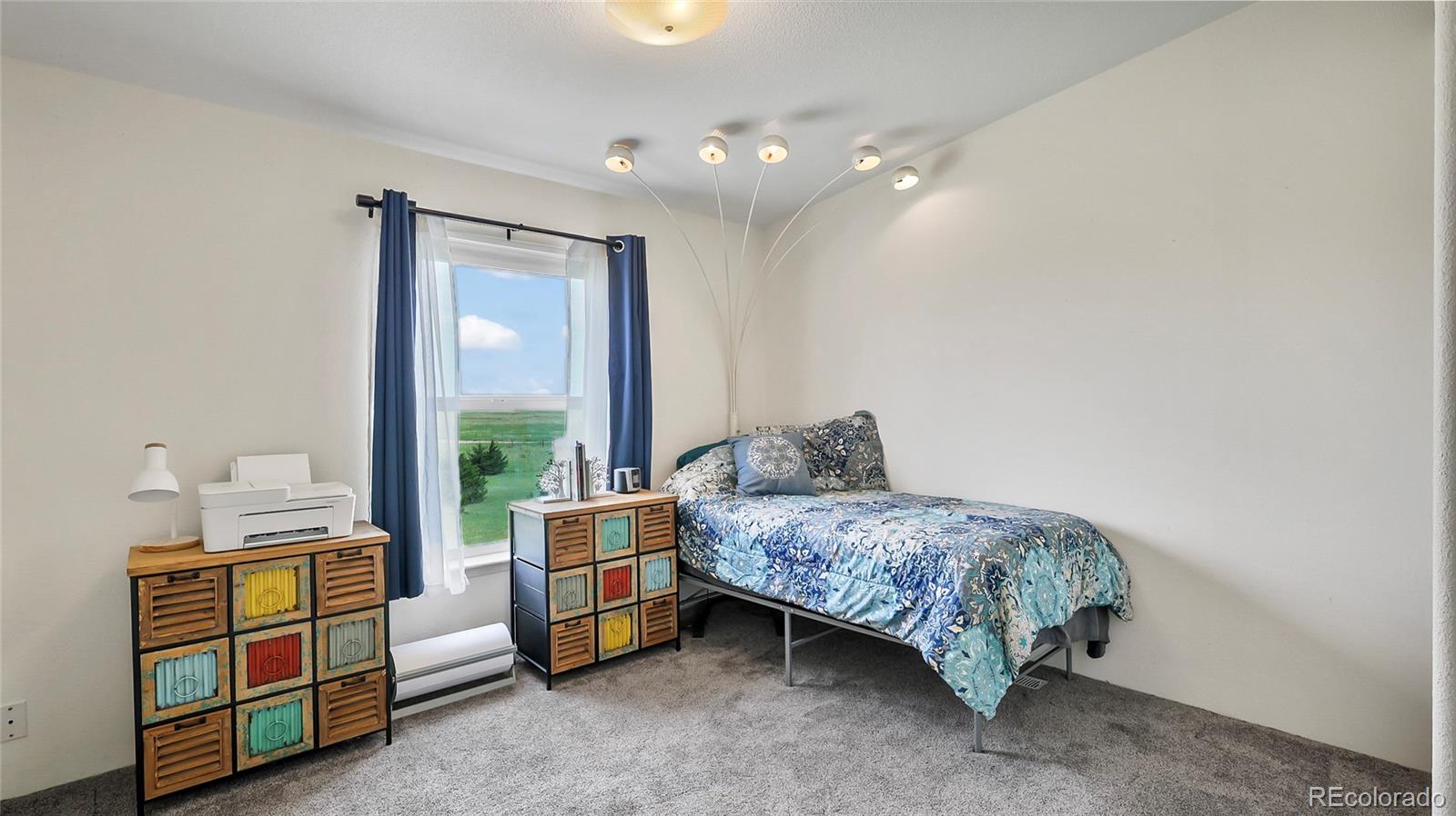 48984 County Road Akron, CO 80720 - Photo 23 of 35 a living room with furniture and a window