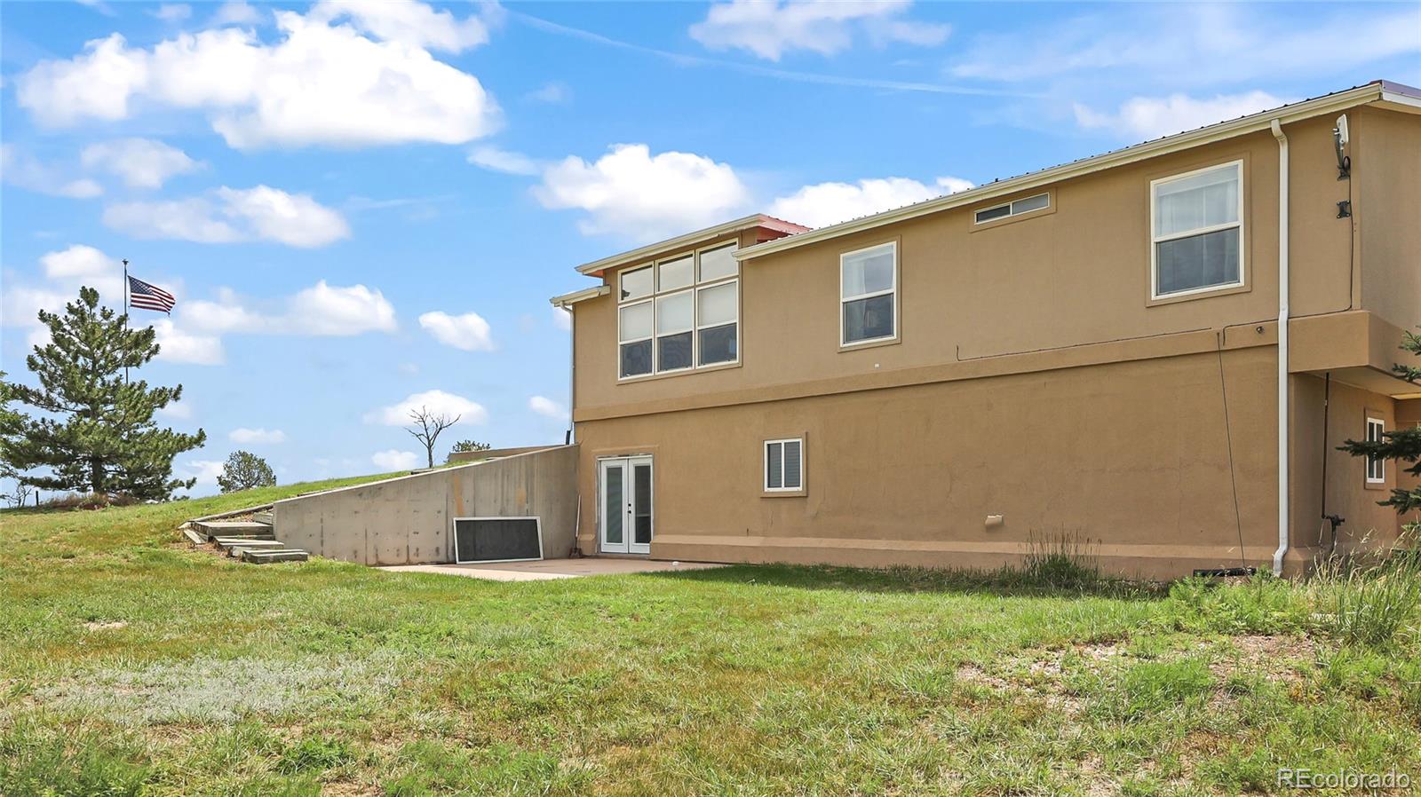 48984 County Road Akron, CO 80720 - Photo 30 of 35 a backyard of a house with lots of green space