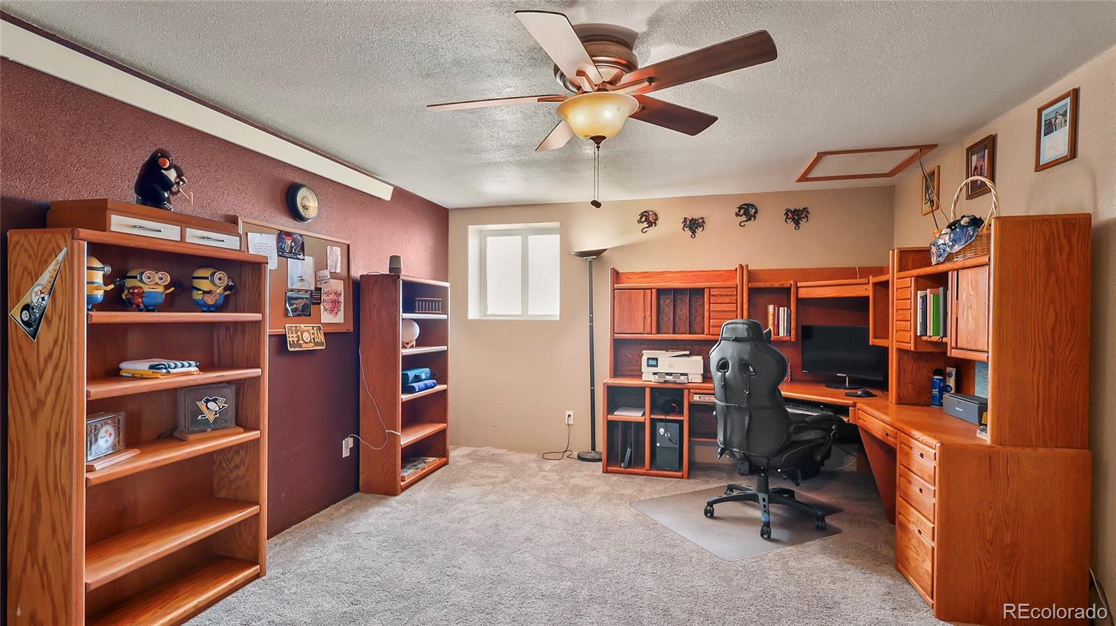 48984 County Road Akron, CO 80720 - Photo 9 of 35 a view of a workspace with furniture