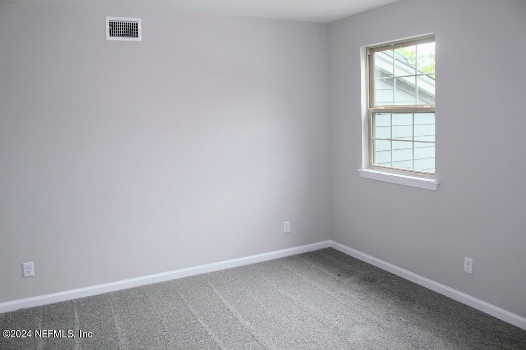 4146 Quiet Creek Loop, Unit 131 Middleburg, FL 32068 - Photo 17 of 39 an empty room with a window