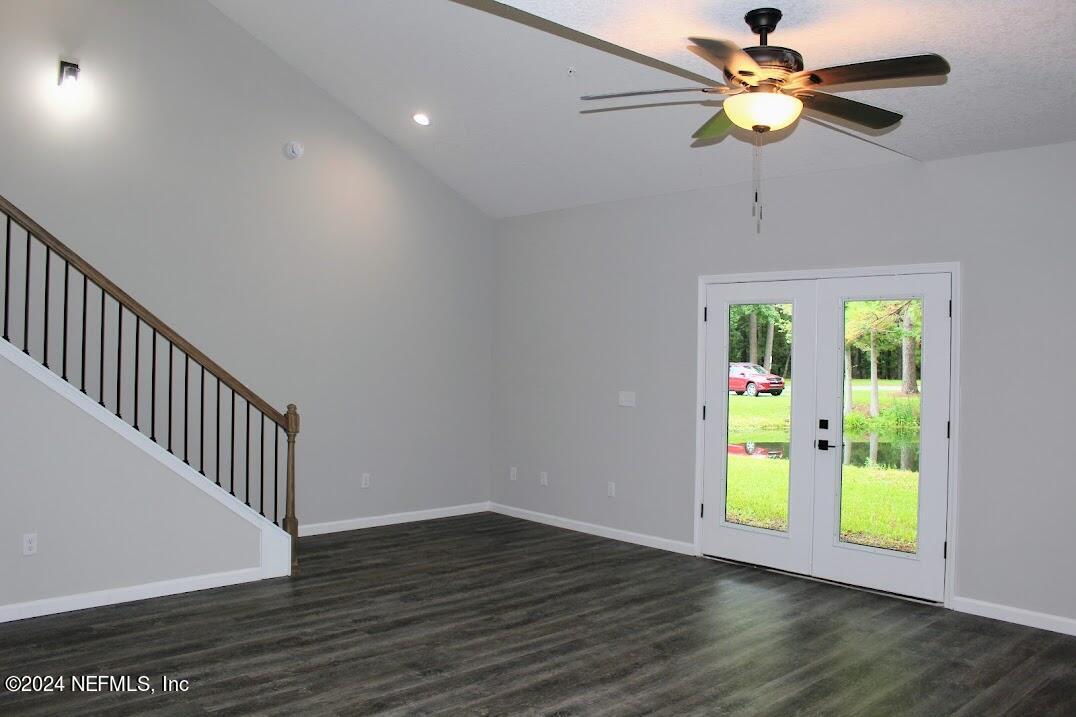 4146 Quiet Creek Loop, Unit 131 Middleburg, FL 32068 - Photo 7 of 39 a view of an empty room with a window and wooden floor